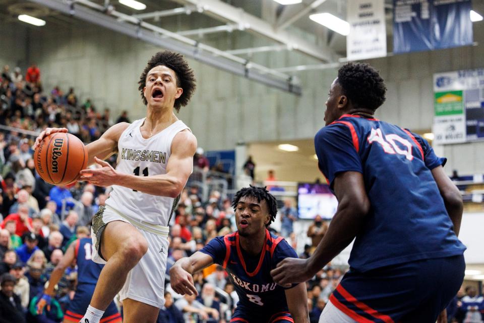 Penn’s Joe Smith (11) goes up for a shot as Kokomo's Flory Bidunga (40) defends during the Penn-Kokomo high school 4A Semi-State Championship basketball game on Saturday, March 18, 2023, at Michigan City High School in Michigan City, Indiana.