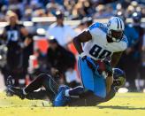 Chris Prosinski #42 of the Jacksonville Jaguars attempts to tackle Jared Cook #89 of the Tennessee Titans during the game at EverBank Field on November 25, 2012 in Jacksonville, Florida. (Photo by Sam Greenwood/Getty Images)