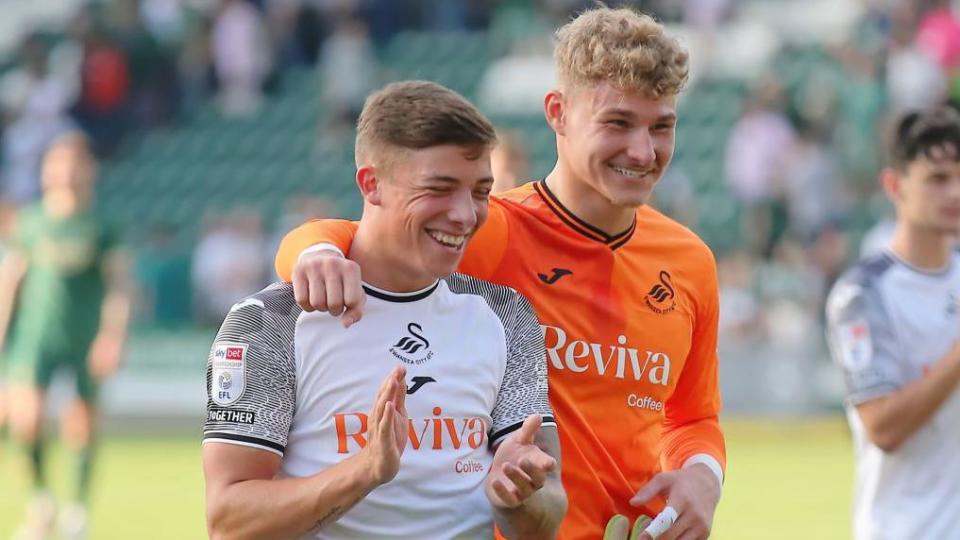 Harrison Ashby and Carl Rushworth at Swansea last season