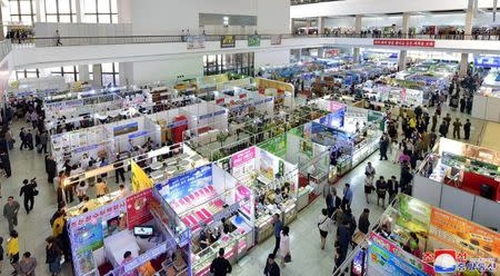 FILE PHOTO: Vendors and visitors at the 21st Pyongyang Spring International Trade Fair at the Three-Revolution Exhibition House, in this undated photo released by North Korea's Korean Central News Agency (KCNA) in Pyongyang May 22, 2018. KCNA/via REUTERS