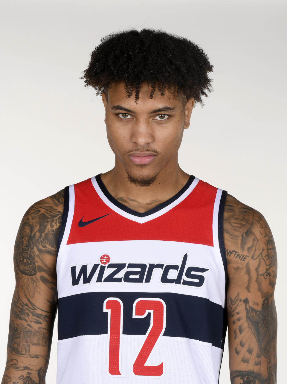 File-This photo taken Sept. 24, 2018, shows Washington Wizards forward Kelly Oubre Jr., posing for a photograph during an NBA basketball media day, in Washington. A person familiar with the deal says the Washington Wizards have an agreement in principle to acquire Trevor Ariza from the Phoenix Suns for Oubre Jr. and Austin Rivers. The person spoke to The Associated Press on condition of anonymity Saturday, Dec. 15, 2018, because it had not been announced by either team.(AP Photo/Nick Wass, File)