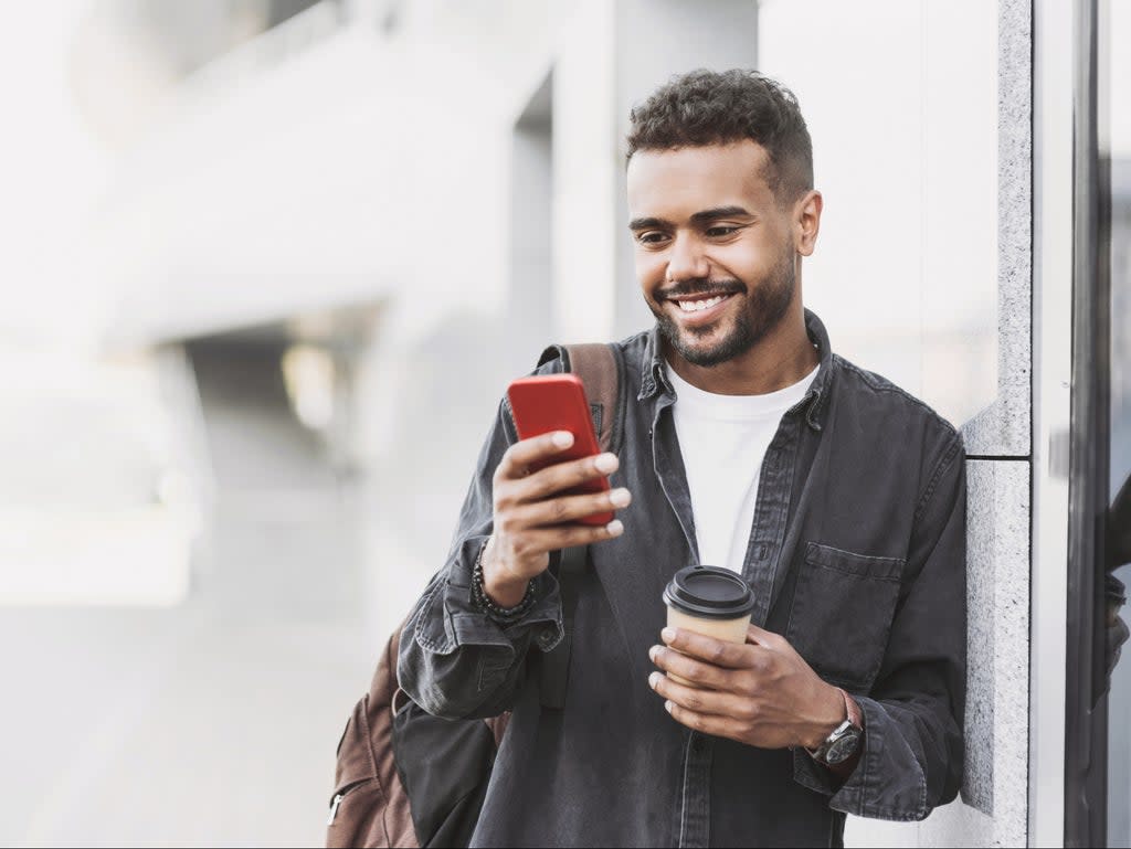 A young person looks at memes on his mobile phone (Getty Images/iStockphoto)