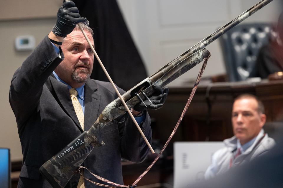 Kenneth Kinsey, crime scene specialist, shows how cartridges may have been ejected from the gun that killed Paul Murdaugh during Alex Murdaugh’s trial for murder at the Colleton County Courthouse on Thursday, February 16, 2023. Joshua Boucher/The State/Pool