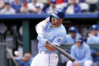 Kansas City Royals' Vinnie Pasquantino hits a two-run single during the first inning of a baseball game against the Houston Astros in Kansas City, Mo., Thursday, April 11, 2024. (AP Photo/Colin E. Braley)