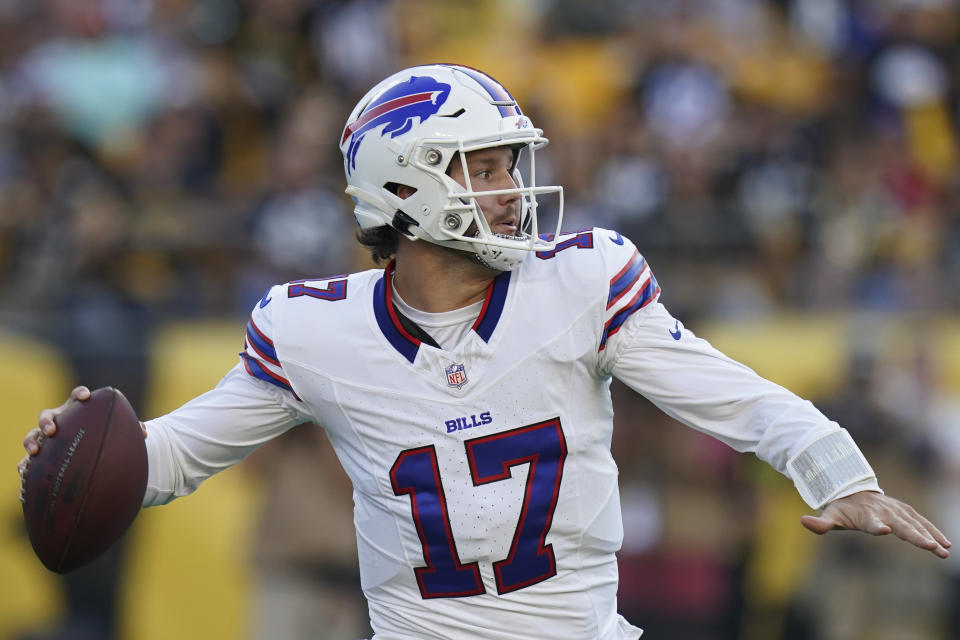 FILE - Buffalo Bills quarterback Josh Allen (17) looks to pass in the first half of an NFL preseason football game against the Pittsburgh Steelers, in Pittsburgh, Saturday, Aug. 19, 2023. Allen is the only QB in NFL history with three straight seasons throwing 25 touchdown passes and rushing for five scores. (AP Photo/Matt Freed, File)