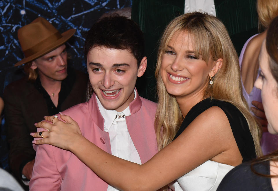 Noah Schnapp and Millie Bobby Brown at an event