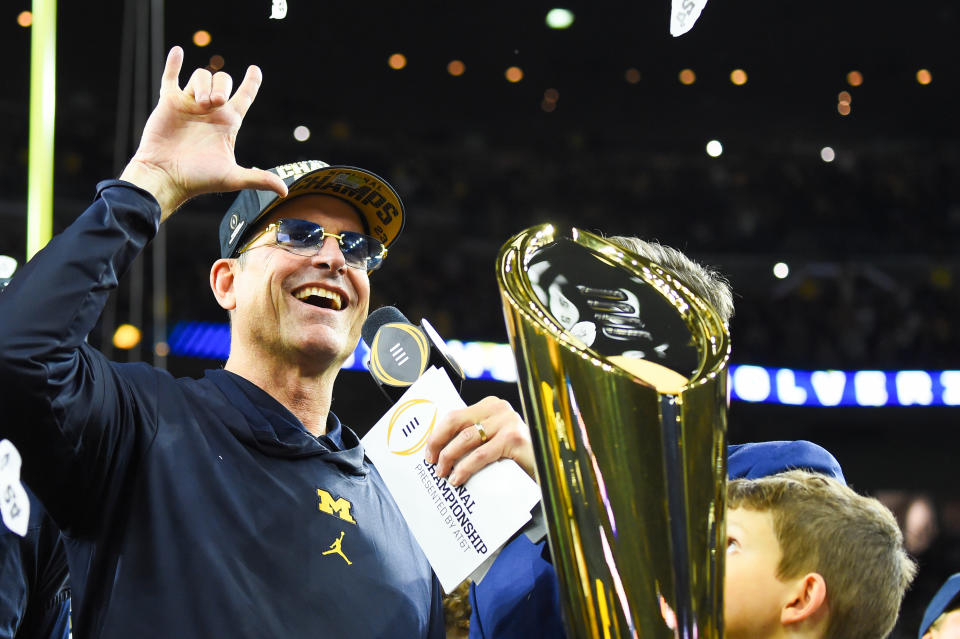 Jim Harbaugh promised his Michigan players if they went undefeated and won a national title he would get a tattoo. (Photo by CFP/Getty Images)