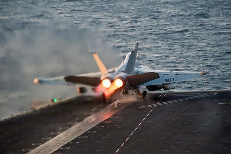 An EA-18G Growler launches from the Nimitz-class aircraft carrier USS Carl Vinson (CVN 70) in this U.S. Navy picture taken in the Arabian Gulf October 28, 2014. REUTERS/U.S. Navy/Mass Communication Specialist 2nd Class John Philip Wagner Jr./Handout via Reuters