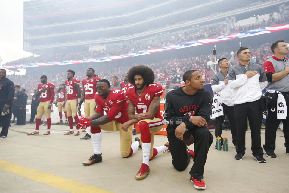 Eli Harold #58, Colin Kaepernick #7 and Eric Reid #35 of the San Francisco 49ers kneel on the sideline, during the anthem, prior to the game against the New York Jets at Levi Stadium on December 11, 2016 in Santa Clara, California.&nbsp; (Photo: Michael Zagaris via Getty Images)