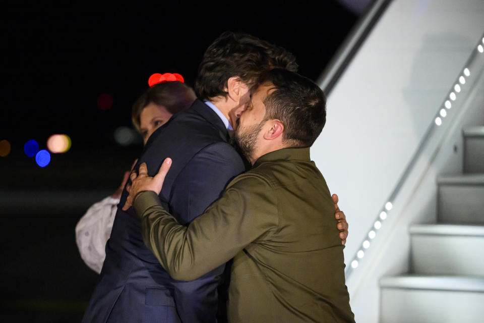 Canadian Prime Minister Justin Trudeau, left, embraces Ukrainian President Volodymyr Zelenskyy as they meet on the tarmac at Ottawa Macdonald-Cartier International Airport in Ottawa, Ontario, on Thursday, Sept. 21, 2023. (Justin Tang/The Canadian Press via AP)