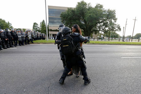 Protestor Ieshia Evans is detained by law enforcement near the headquarters of the Baton Rouge Police Department in Baton Rouge, Louisiana, U.S. July 9, 2016. REUTERS/Jonathan Bachman