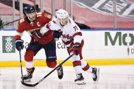 Florida Panthers center Aleksander Barkov (16) and Carolina Hurricanes right wing Jesper Fast (71) battle for position during the second period of an NHL hockey game, Monday, March 1, 2021, in Sunrise, Fla. (AP Photo/Wilfredo Lee)