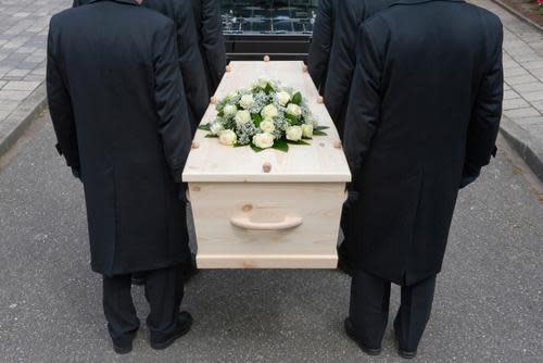 Pallbearers carrying a coffin