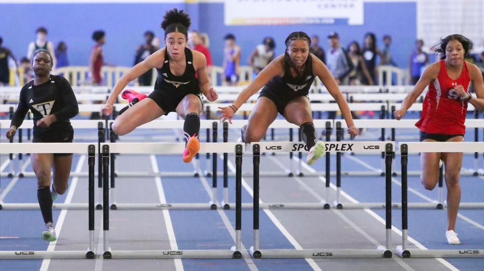 Tatnall's Arianna Montgomery (second from left) and teammate Kiara Davis mirror each other's strides but it is Montgomery who would win the 55 meter hurdles by three-hundredths of a second during the DIAA indoor track and field championships at the Prince George's Sports and Learning Complex in Landover, Md., Saturday, Feb. 3, 2024. Tatnall's Alexis Turlue (left) was fourth and Smyrna's Aaliyah Turpin runs to a third place (right).