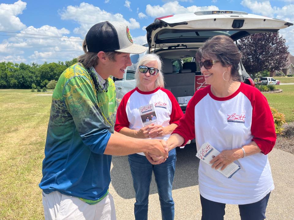 While campaigning in Columbia, mayoral candidate Sheila Butt talks to constituent, and first time voter JonPaul Scribner, 18, a fourth generation businessman with Scribner & Son Lawn and Landscape in Maury County.