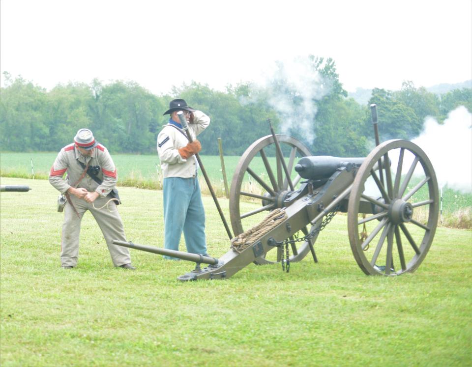 Two soldiers shoot the cannon during Saturday's Civil War Living History, hosted by Historic Prospect Place Estate and The G.W. Adams Educational Center.