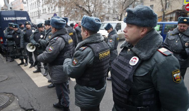 Police officers stand guard outside a court where Russian martial arts champion Rasul Mirzaev was found guilty of involuntary manslaughter, Moscow, Russia, Tuesday, Nov. 27, 2012. Mirzayev was sentenced to two years of house arrest over the death of a man he had punched outside a club. (AP Photo/Misha Japaridze)