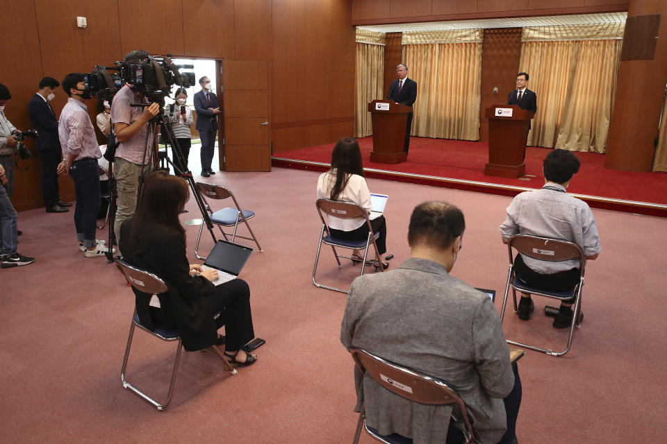 U.S. Deputy Secretary of State Stephen Biegun, rear left, and South Korea's First Vice Foreign Minister Cho Sei-young, rear right, attend a news briefing after their meeting at the foreign ministry in Seoul Wednesday, July 8, 2020. Biegun is in Seoul to hold talks with South Korean officials about allied cooperation on issues including North Korea. (Chung Sung-jun/Pool Photo via AP)