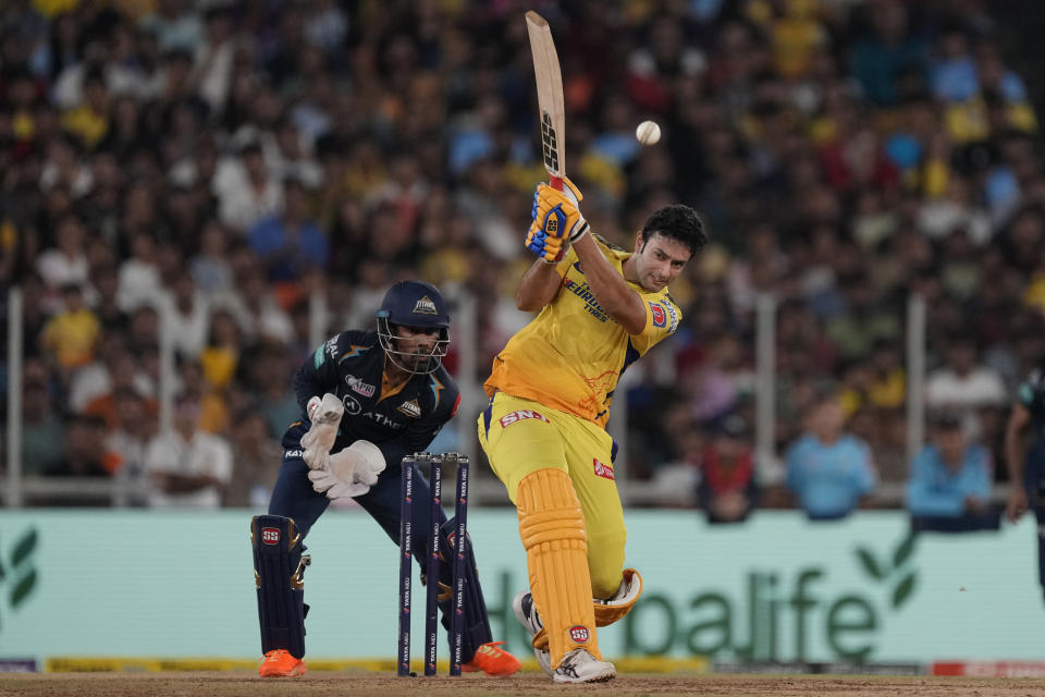 Chennai Super Kings' Shivam Dube, right, plays a shot during the Indian Premier League final cricket match between Chennai Super Kings and Gujarat Titans in Ahmedabad, India, Monday, May 29, 2023. (AP Photo/Ajit Solanki)