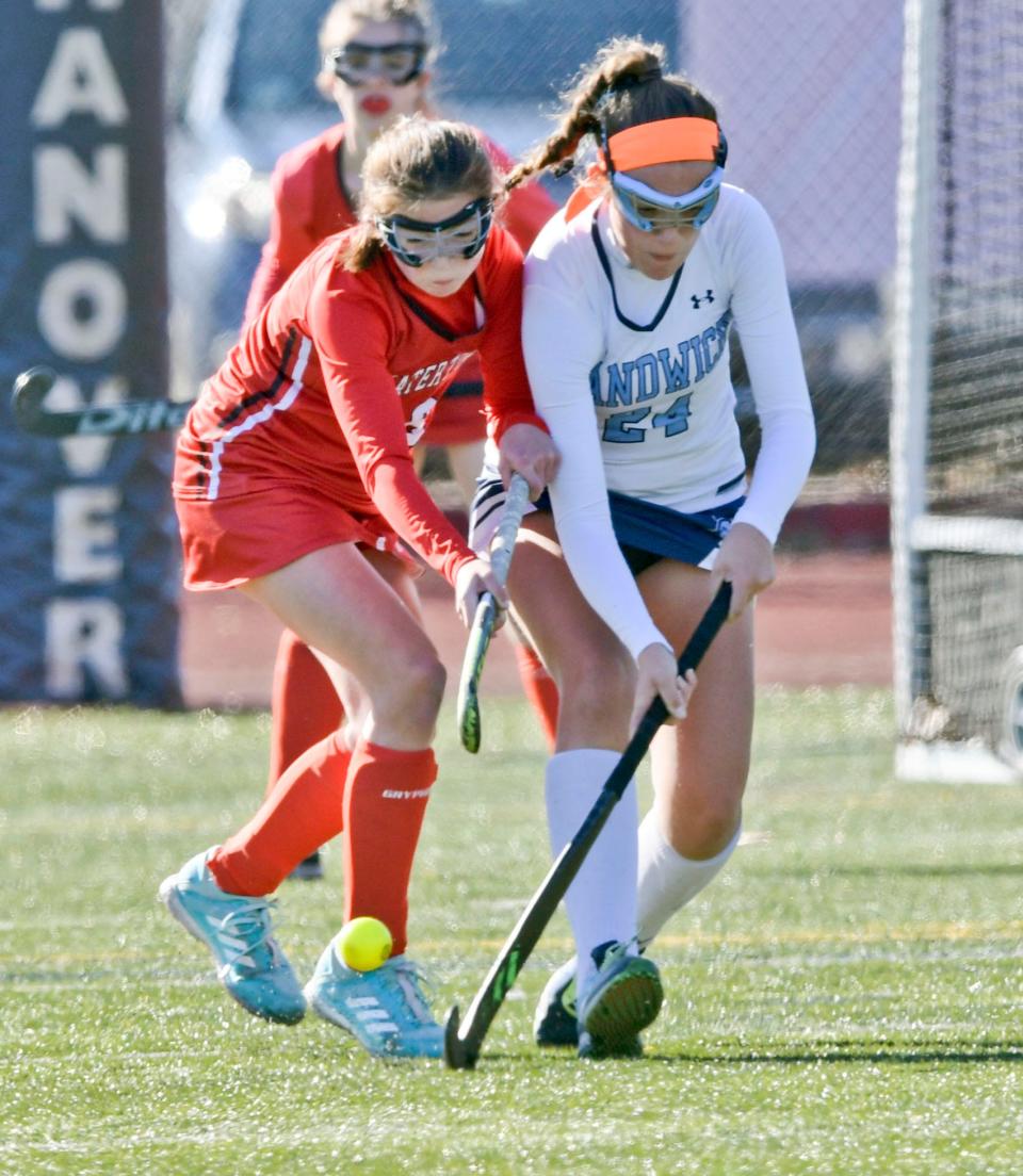 Julia Giampietro of Sandwich and Rachel Egan of Watertown collide while going after the ball.