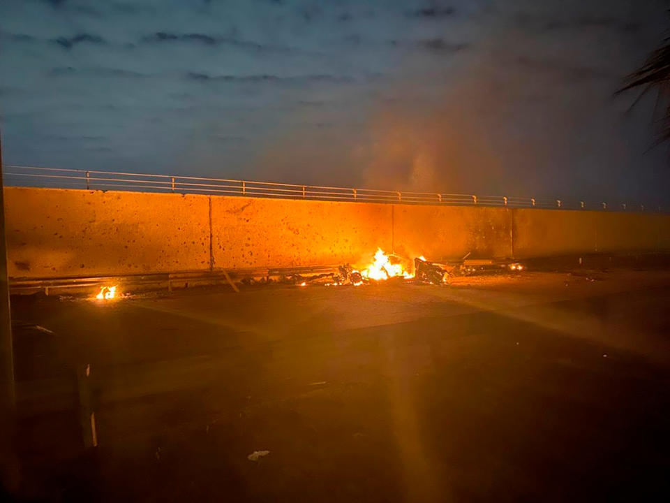A burning vehicle following an airstrike at Baghdad International Airport on Jan. 3, 2020. The Pentagon said the U.S. military killed Gen. Qasem Soleimani, the head of Iran's elite Quds Force, at the direction of President Trump. | Iraqi Prime Minister Press Office/AP