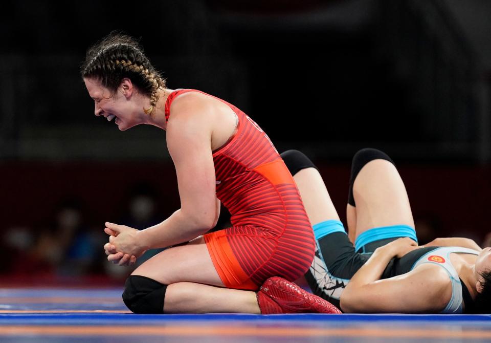 At the Tokyo Olympics in 2021, Adeline Gray (left) celebrates after defeating Aiperi Medet Kyzy in women's freestyle wrestling.
