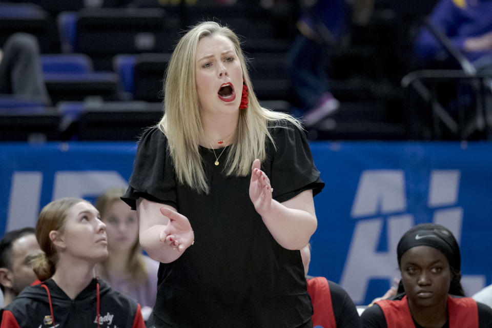 FILE - UNLV head coach Lindy La Rocque reacts in the first half of a first-round college basketball game against Michigan in the women's NCAA Tournament, March 17, 2023, in Baton Rouge, La. La Rocque plans on taking her team on a destination trip each year right before the holidays because the Lady Rebels' home arena is being used for a rodeo. Last year it was Hawaii, this season it's New York. (AP Photo/Matthew Hinton, File)