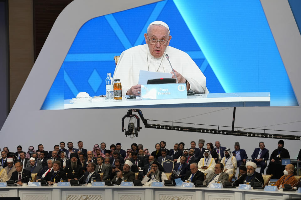 Participants listen to Pope Francis speaking at the '7th Congress of Leaders of World and Traditional Religions, in Nur-Sultan, Kazakhstan, Wednesday, Sep. 14, 2022. Pope Francis is on the second day of his three-day trip to Kazakhstan. (AP Photo/Alexander Zemlianichenko)