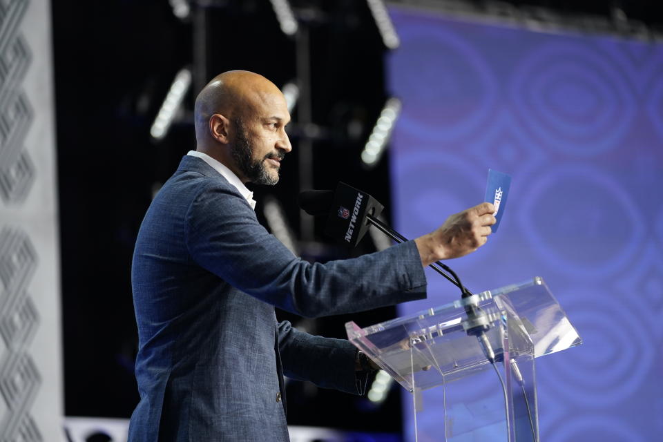 Actor and comedian Keegan-Michael Key announces Kentucky defensive end Josh Paschal as the Detroit Lions selection during the second round of the NFL football draft Friday, April 29, 2022, in Las Vegas. (AP Photo/John Locher)