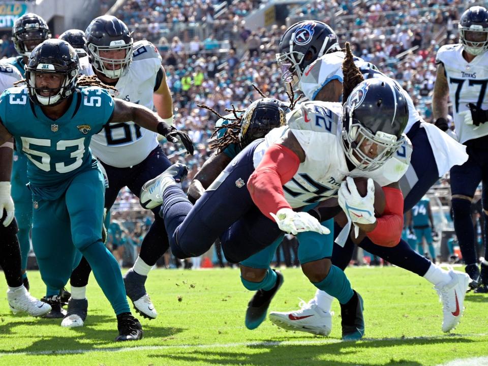 Derrick Henry dives into the end zone against the Jacksonville Jaguars.