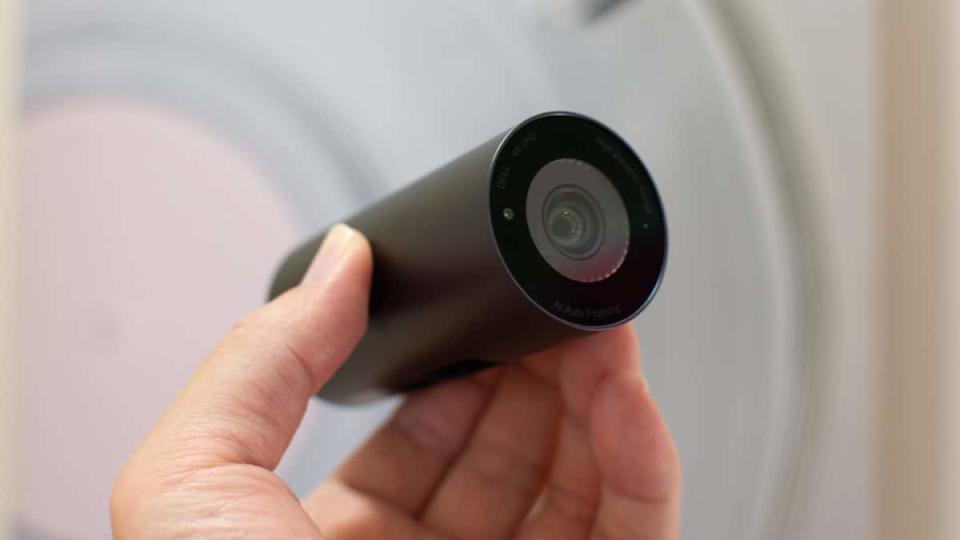 close-up of dell ultrasharp webcam in hand