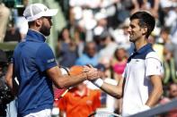 Mar 23, 2018; Key Biscayne, FL, USA; Novak Djokovic of Serbia (R) shakes hands with Benoit Paire of France (L) after their match on day four of the Miami Open at Tennis Center at Crandon Park. Paire won 6-3, 6-4. Mandatory Credit: Geoff Burke-USA TODAY Sports