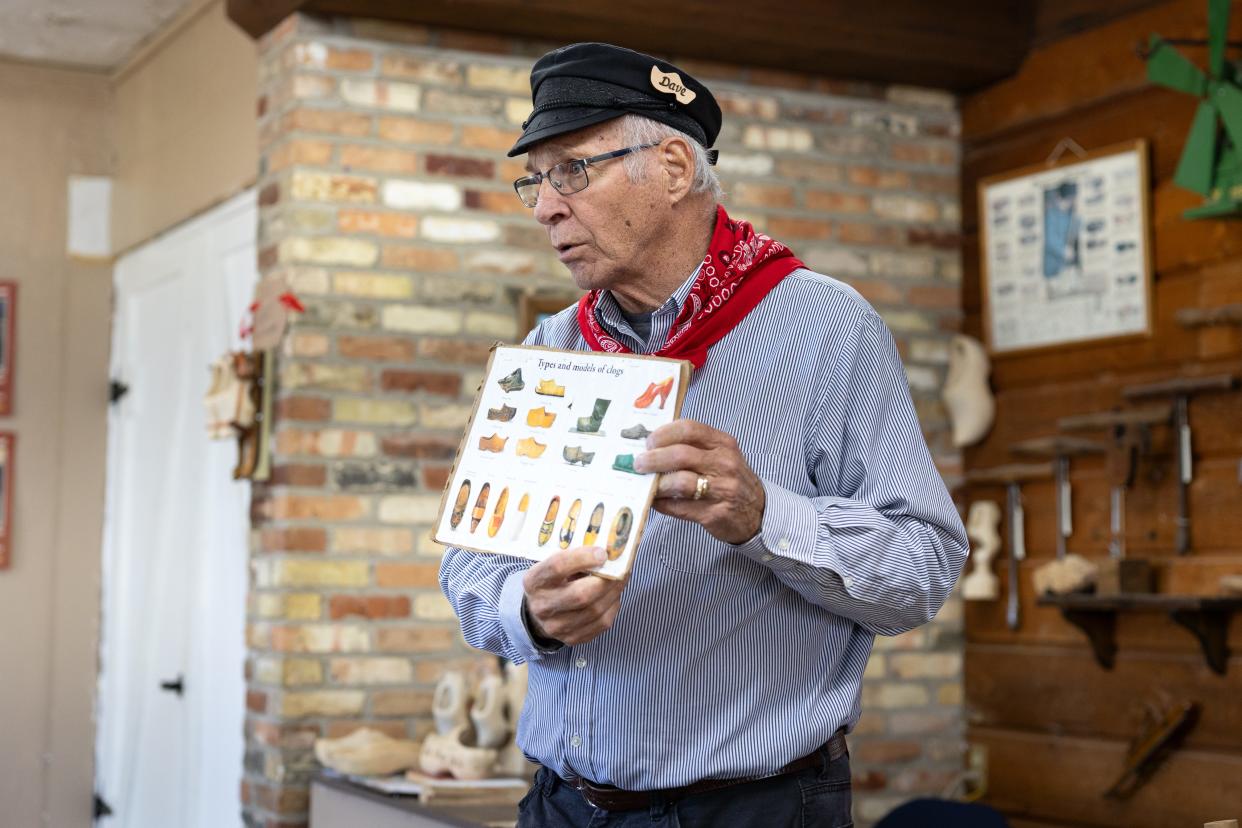 Dave Van Kampea, a Holland native, demonstrates how wooden clogs or klompen are made on April 30.