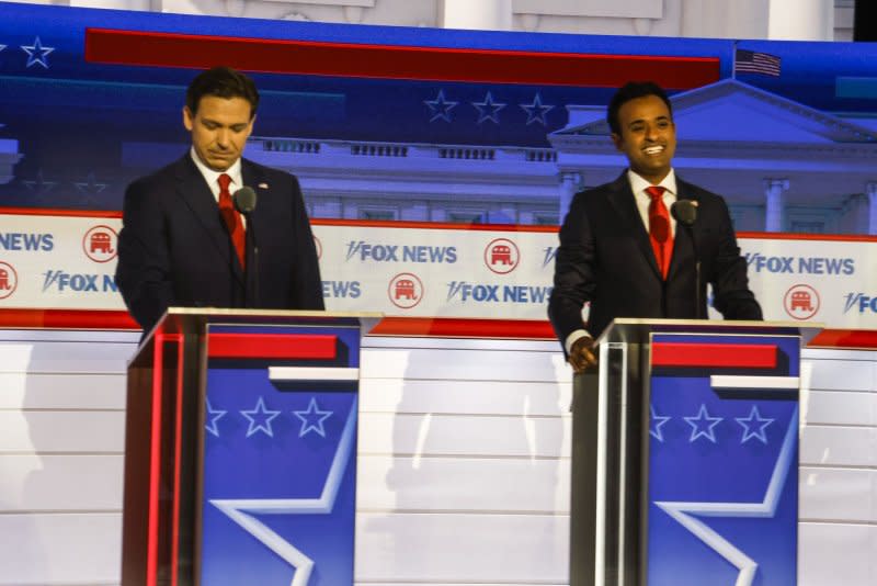 Florida Gov. Ron DeSantis and entrepreneur Vivek Ramaswamy stand at their positions during the first Republican presidential candidate debate of the 2024 presidential race at Fiserv Forum in Milwaukee, on Aug. 23. File Photo by Tannen Maury/UPI