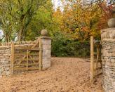 <p> Driveway gates are a brilliant way to up your plot's security levels.  </p> <p> Automatic, timber, metal – there are tons of styles to choose from. And they're a must-have if you have pets or small children, as will keep everyone safely inside. </p> <p> We adore this wooden, double design for a timeless approach. The warm tone complements the gravel below perfectly, and its laid-back finish works well alongside the traditional stone wall, too. </p>