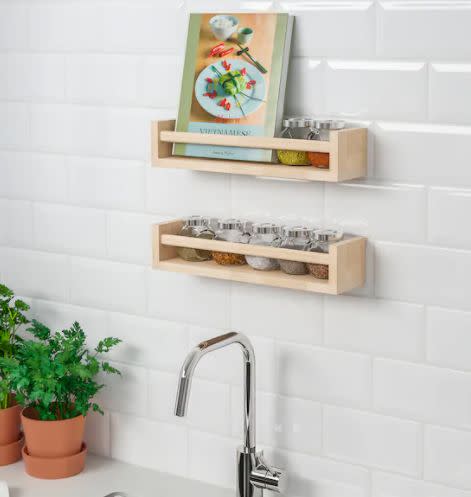 These <a href="https://fave.co/2wNZXSl" target="_blank" rel="noopener noreferrer">small wooden racks</a> can be mounted to your wall to save counter space. Use them for spices, cookbooks, oil and vinegar or use them in the bathroom to store beauty products. Find it for $5 at <a href="https://fave.co/2wNZXSl" target="_blank" rel="noopener noreferrer">IKEA</a>.