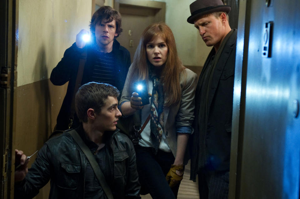 This undated publicity photo released by Summit Entertainment, LLC shows, clockwise from bottom, Dave Franco, Jesse Eisenberg, Isla Fisher and Woody Harrelson, in a scene from the film, "Now You See Me." (AP Photo/Summit Entertainment, LLC, Barry Wetcher, SMPSP)