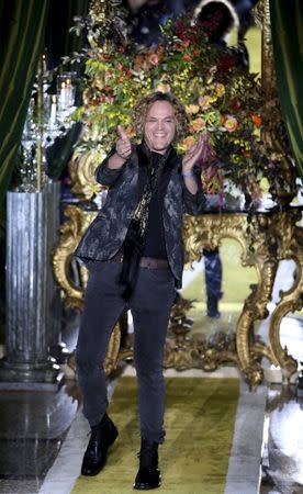 Norwegian designer Peter Dundas acknowledges the applause at the end of Roberto Cavalli Autumn/Winter 2016 woman collection during Milan Fashion Week, Italy, February 24, 2016. REUTERS/Stefano Rellandini