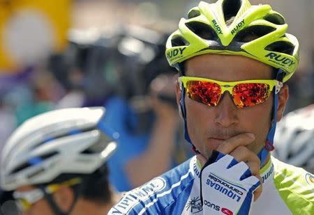 Liquigas-Cannondale rider Ivan Basso of Italy awaits the start of the eight stage of the 99th Tour de France cycling race between Belfort and Porrentruy July 8, 2012. REUTERS/Stephane Mahe