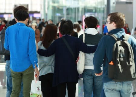 Family members of victims of the ferry accident on the Danube river, leave for Hungary at Incheon International Airport in Incheon