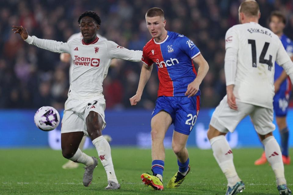 Battle: Adam Wharton outshone Kobbie Mainoo as Manchester United were thrashed by Crystal Palace (AFP via Getty Images)