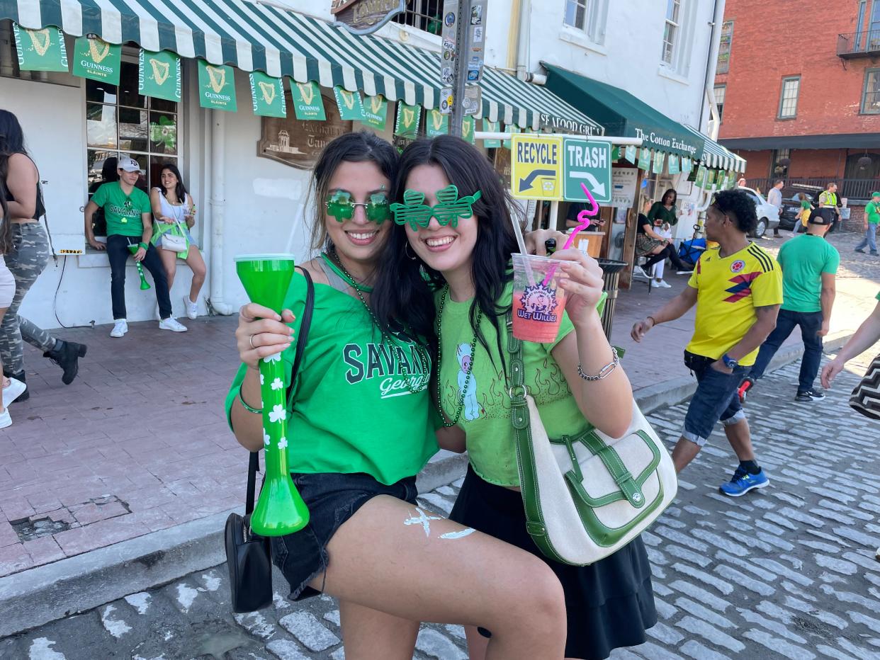 Claudio Gervacio (left) and Stephanie Sommerfeld on River Street during the St. Patrick's Day festival.