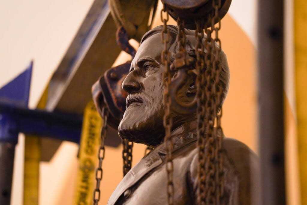 This Monday, Dec. 21, 2020 photo provided by the Office of the Governor of Virginia shows a statue of Confederate Gen. Robert E. Lee being removed from the National Statuary Hall Collection in Washington. (Jack Mayer/Office of Governor of Virginia, File)