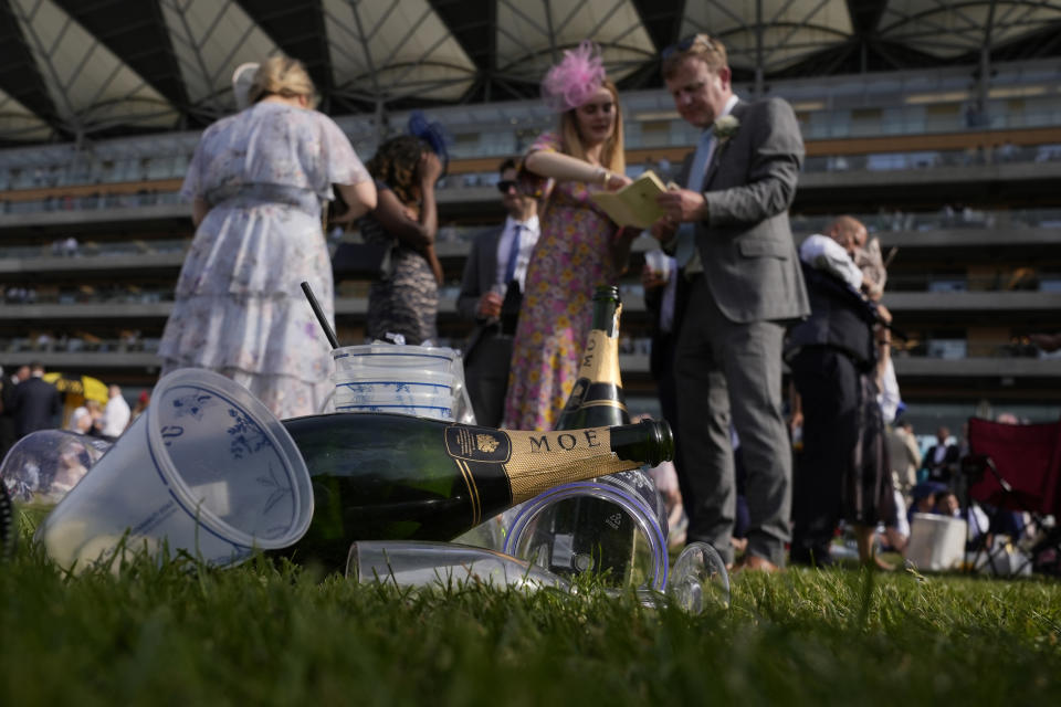 Racegoers take in the atmosphere on the third day of the Royal Ascot horserace meeting, at Ascot Racecourse, in Ascot, England, Thursday, June 16, 2022. The third day is traditionally known as Ladies Day. (AP Photo/Alastair Grant)