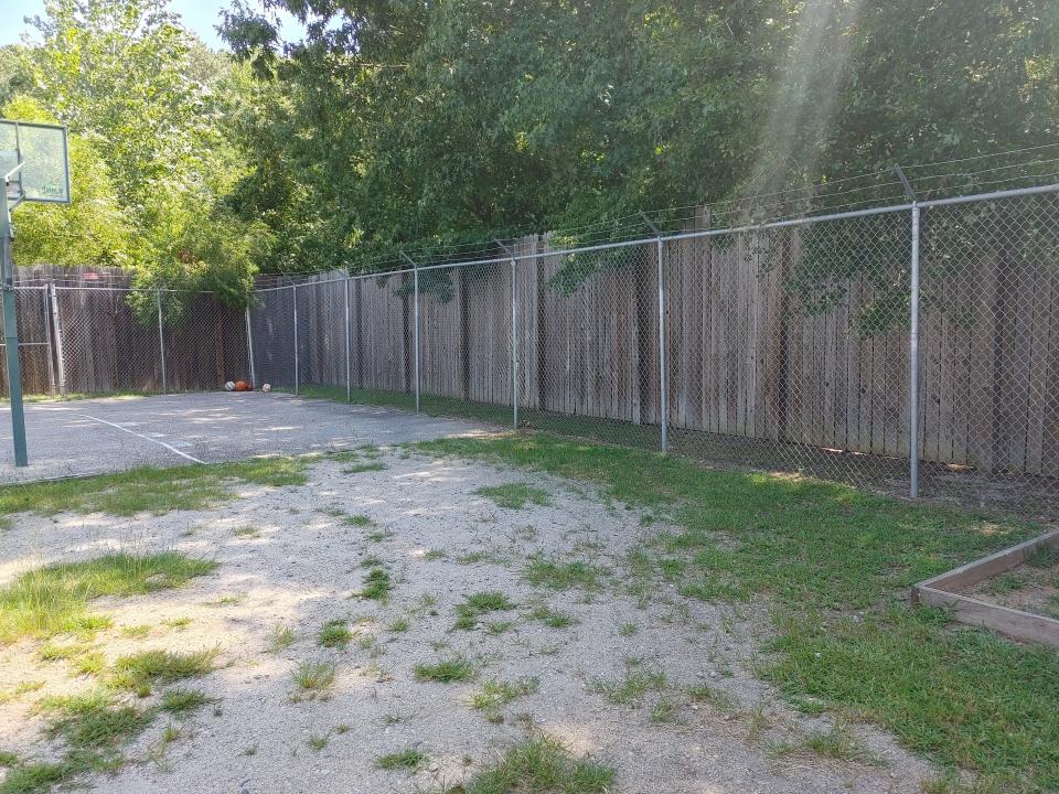 This area with security wire fencing rings what passes for an exercise yard at a psychiatric center for children in North Carolina. Documented abuses at these centers, heavily detailed in a USA TODAY Network investigation in 2021 called Locked Away, are prompting legal action against the state.