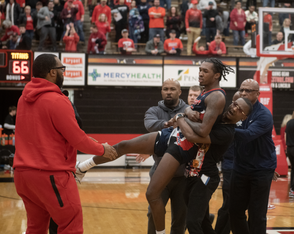 Antoine Davis is carried off after a heated exhange between Youngstown State players at the end of the game.