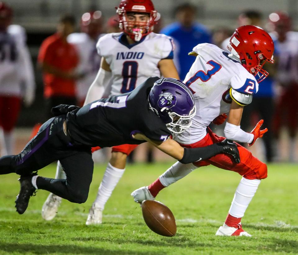Shadow Hills' Zach Goebel (7) hits Indio's Steven Martinez (2) causing a fumble that is recovered by Shadow Hills during the third quarter of their game at Shadow Hills High School in Indio, Calif., Friday, Aug. 18, 2023.