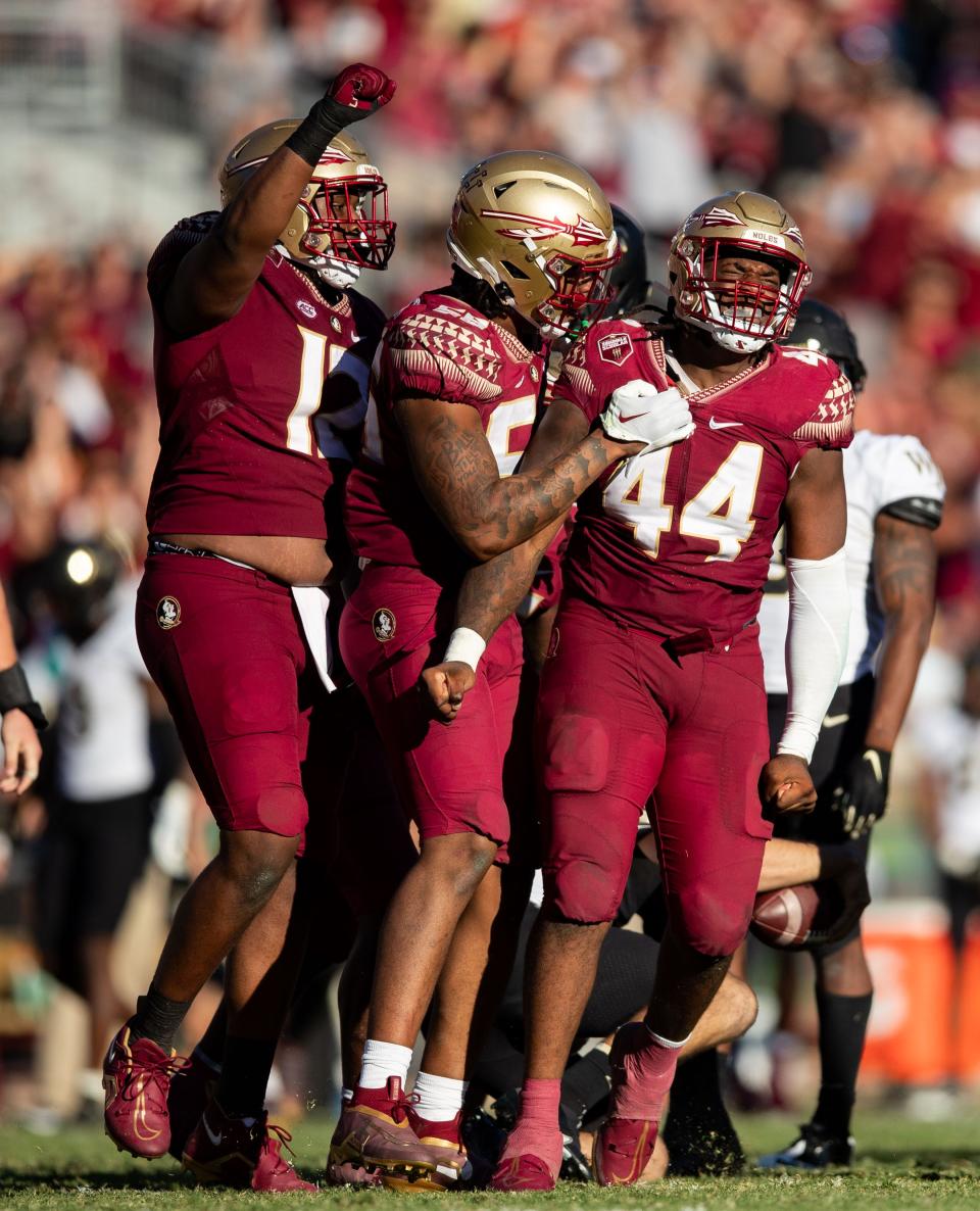 Florida State Seminoles defensive tackle Joshua Farmer (44) and his teammates celebrate his sack. The Florida State Seminoles lost to the Wake Forest Demon Deacons 31-21 Saturday, Oct. 1, 2022.