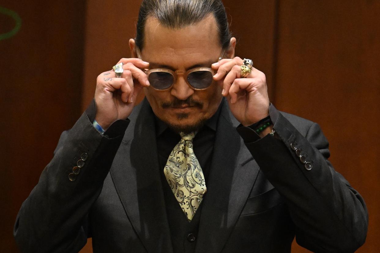 Johnny Depp testifies during his defamation trial against Amber Heard n the Fairfax County Circuit Courthouse in Fairfax, Virginia