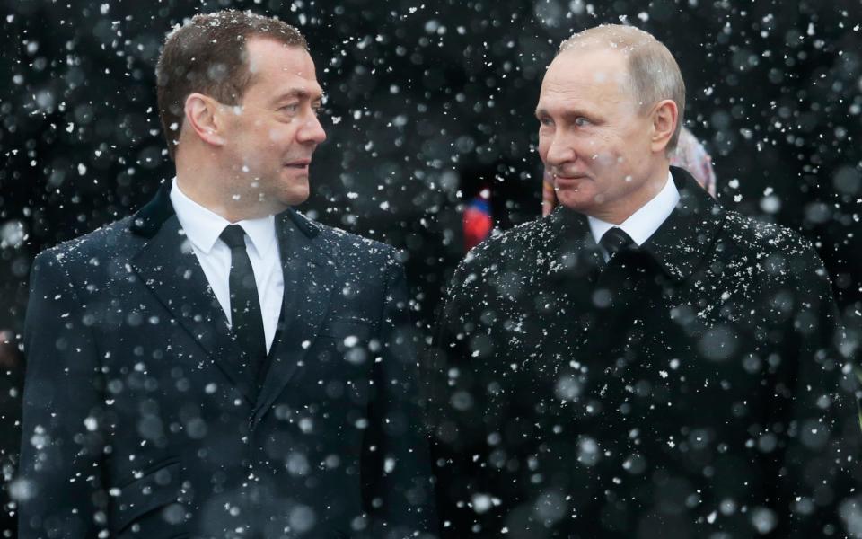 Russian President Vladimir Putin, right, and Prime Minister Dmitry Medvedev